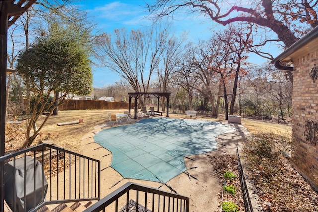 view of pool featuring fence, grilling area, a pergola, and a patio