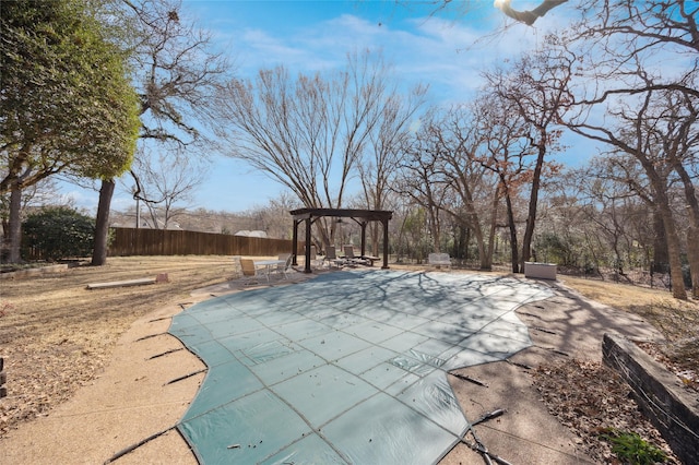 view of pool with a patio area, fence, and a fenced in pool