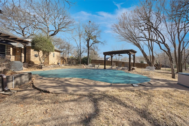 view of swimming pool featuring a patio, fence, a fenced in pool, and a pergola