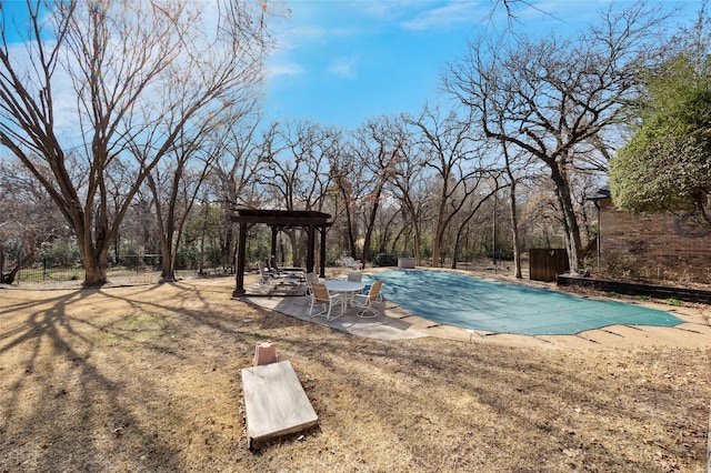 view of pool featuring a yard, a covered pool, and a patio