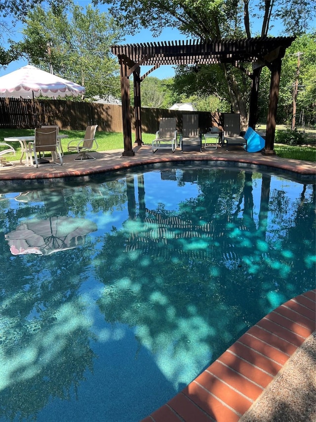 view of pool with a patio, fence, a fenced in pool, and a pergola