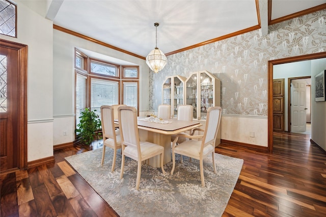 dining space with wallpapered walls, baseboards, ornamental molding, dark wood-type flooring, and a chandelier