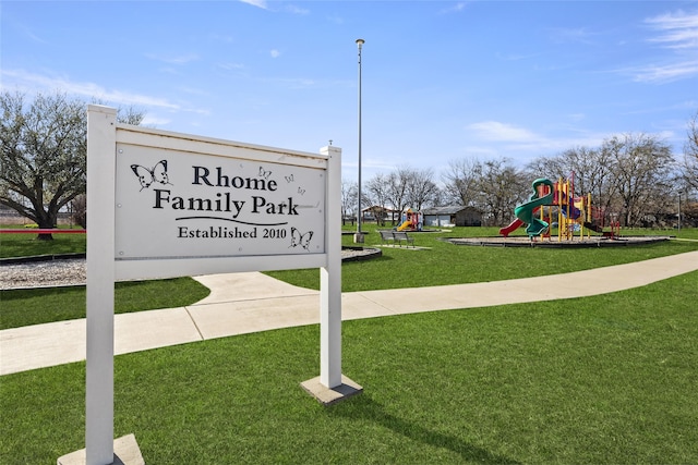 view of community with playground community and a yard