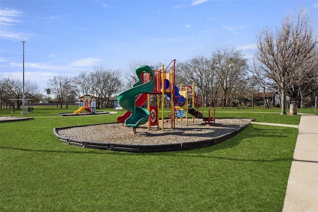 community playground featuring a yard