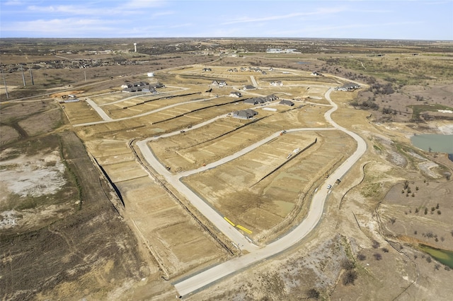 birds eye view of property with a rural view