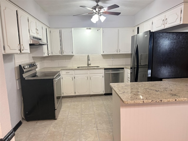 kitchen with stainless steel appliances, white cabinetry, and a sink