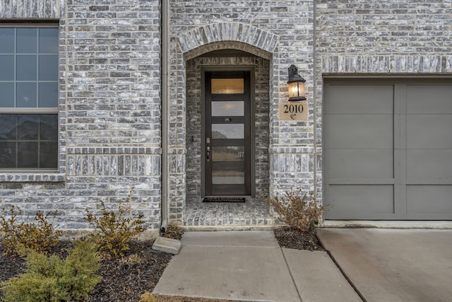 entrance to property with brick siding