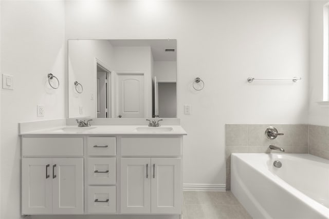 2720 Green River Rd, Royse City, TX 75189 - bathroom with double vanity, a bath, tile patterned floors, and baseboards