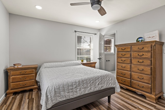 bedroom featuring ceiling fan, dark wood-type flooring, recessed lighting, and baseboards