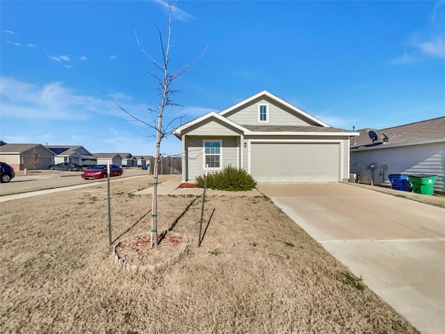 single story home with a garage, a residential view, and driveway