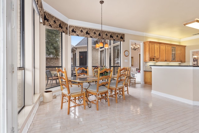 dining room with a chandelier, light wood-style floors, visible vents, and ornamental molding