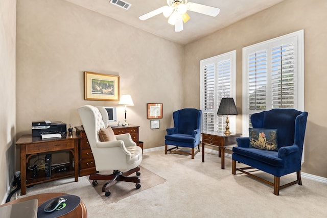 sitting room featuring baseboards, ceiling fan, visible vents, and light colored carpet