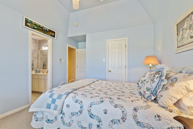 bedroom with light carpet, baseboards, a ceiling fan, and ensuite bathroom