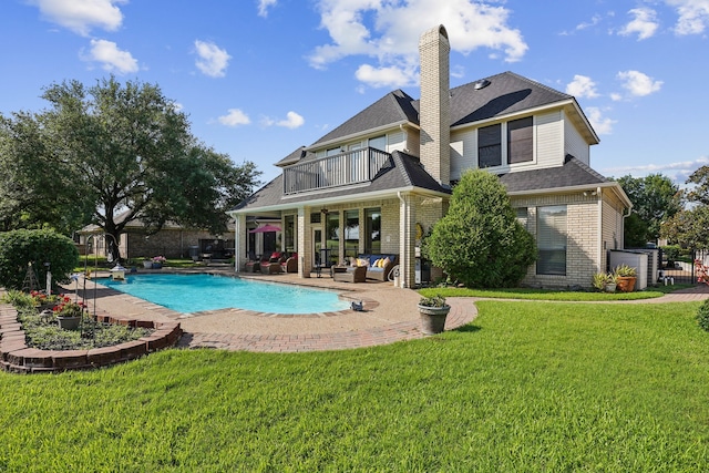 10 Fair Green Dr, Trophy Club, TX 76262 - rear view of property with a balcony, outdoor lounge area, brick siding, and a patio area