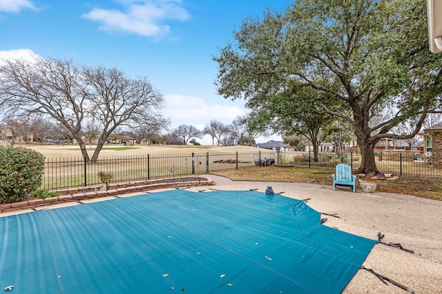 view of pool with a fenced backyard