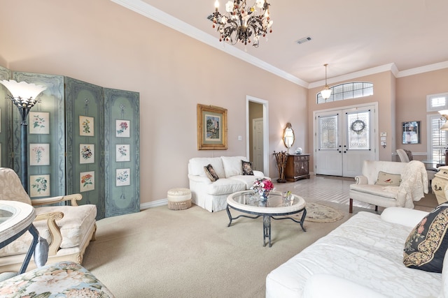 carpeted living area featuring french doors, crown molding, a notable chandelier, visible vents, and baseboards