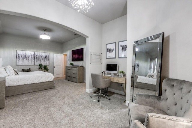 bedroom featuring light carpet, baseboards, and arched walkways