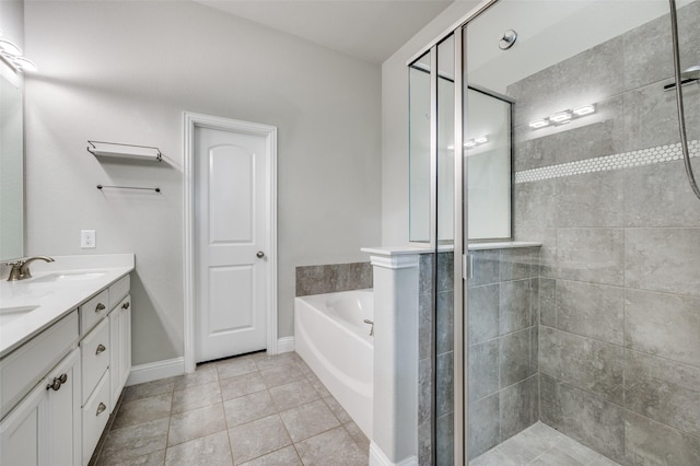 bathroom with a sink, a shower stall, a bath, tile patterned floors, and double vanity