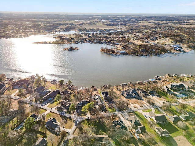 drone / aerial view with a residential view and a water view