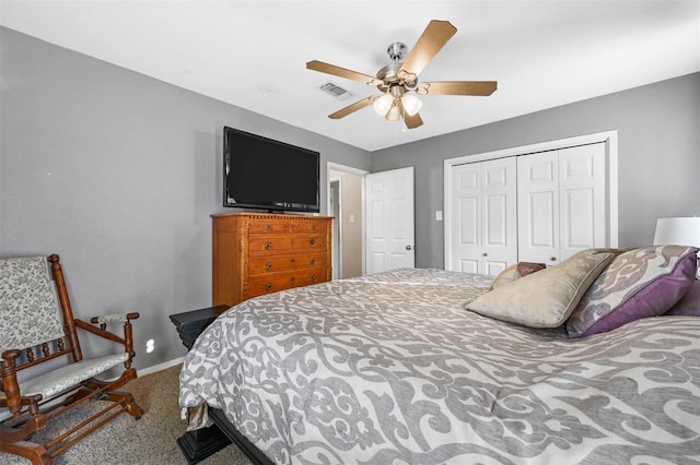 carpeted bedroom with baseboards, ceiling fan, visible vents, and a closet