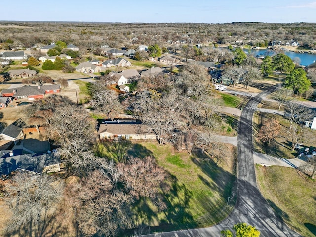 bird's eye view with a water view and a residential view