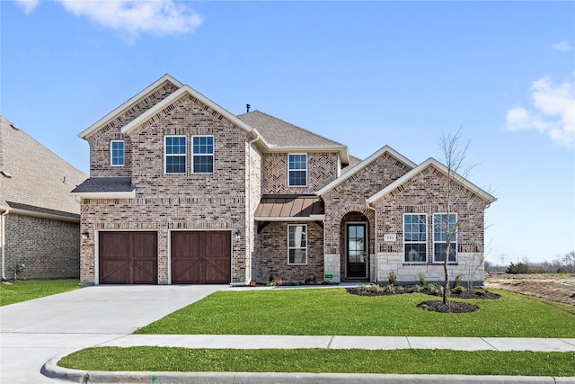 551 Baker Ct, Fate, TX 75189 - view of front facade featuring concrete driveway, an attached garage, a front yard, and brick siding