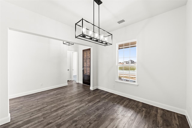 551 Baker Ct, Fate, TX 75189 - unfurnished dining area with a chandelier, dark wood-style flooring, and baseboards