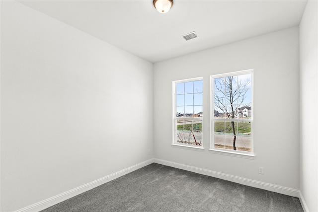 551 Baker Ct, Fate, TX 75189 - spare room featuring baseboards and dark carpet