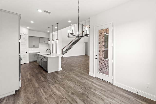 551 Baker Ct, Fate, TX 75189 - kitchen featuring gray cabinetry, recessed lighting, a sink, dark wood-style floors, and open floor plan