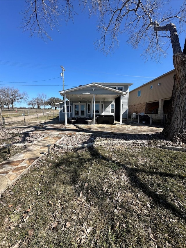 back of house featuring a patio and fence