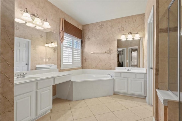 full bathroom with a garden tub, tile patterned flooring, two vanities, and wallpapered walls