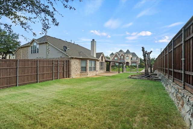 view of yard featuring a patio and fence