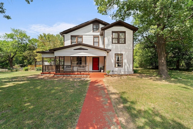 view of front of property with a porch and a front yard