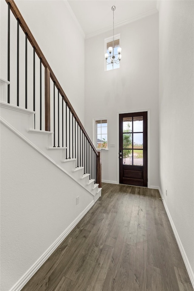 279 Bright Alcove Ct, Lavon, TX 75166 - foyer with a chandelier, wood finished floors, stairway, crown molding, and baseboards