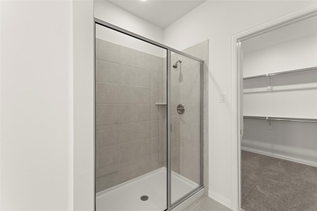 279 Bright Alcove Ct, Lavon, TX 75166 - bathroom with a stall shower, a walk in closet, and baseboards