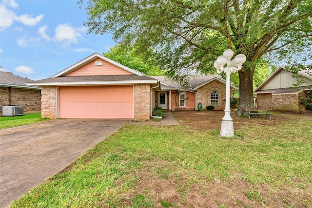 ranch-style home featuring driveway, a garage, a front lawn, and brick siding