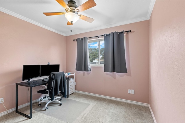 office space featuring baseboards, ceiling fan, carpet flooring, and crown molding