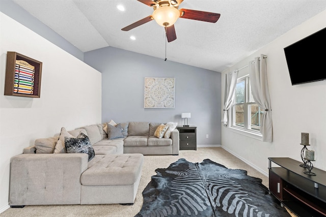 living room featuring lofted ceiling, a textured ceiling, ceiling fan, carpet floors, and baseboards