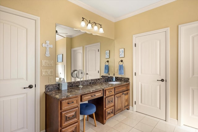 bathroom with ornamental molding, vanity, and tile patterned floors