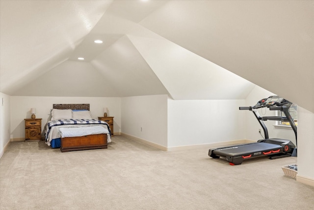 bedroom with carpet, vaulted ceiling, and baseboards