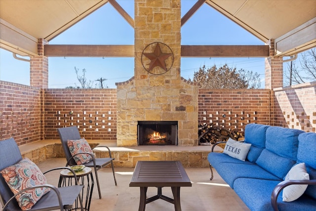 view of patio / terrace with an outdoor living space with a fireplace