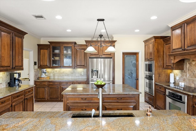 kitchen featuring stainless steel appliances, light stone countertops, visible vents, and light tile patterned flooring