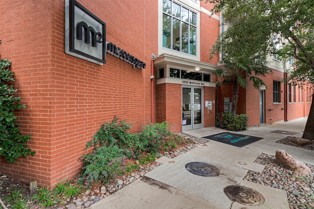 entrance to property with french doors and brick siding