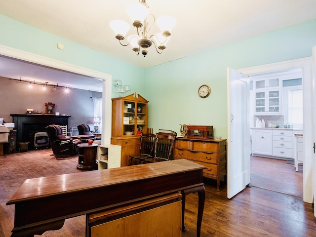 office area with wood finished floors and a chandelier