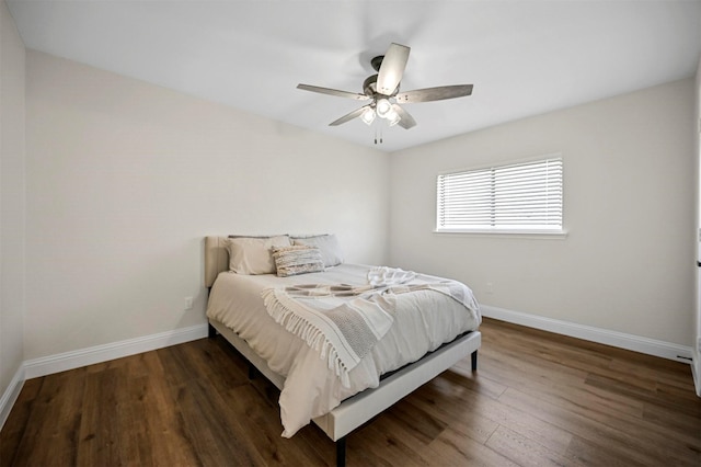 bedroom with wood finished floors, baseboards, and ceiling fan