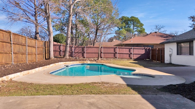 view of swimming pool with a patio, a fenced backyard, and a fenced in pool