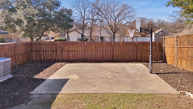 view of patio featuring cooling unit and a fenced backyard