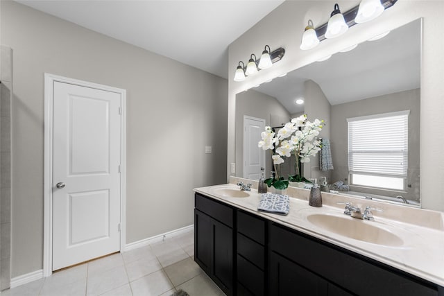 full bathroom featuring double vanity, tile patterned flooring, a sink, and a bath