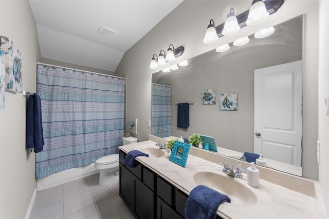 bathroom featuring a sink, double vanity, tile patterned flooring, and visible vents