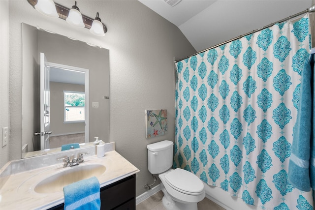 full bath featuring lofted ceiling, a textured wall, toilet, vanity, and baseboards